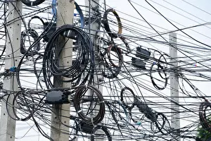 Tangled Prints: messy electrical cables on pole