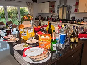 Debris Prints: Messy, untidy kitchen after a party - empty wine & beer bottles