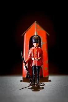 Collectable Prints: Metal lead toy soldier guardsman with a metal sentry box in play worn condition