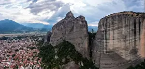 Thessaly Prints: Meteora Greece. Blue sky with clouds over Monastery buildings on top of rocks and Kalambaka town and valley