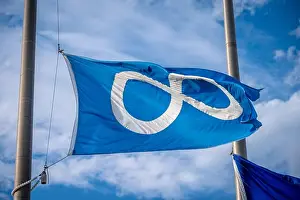 Ensign Prints: Metis flag in Calgary flying at half mast