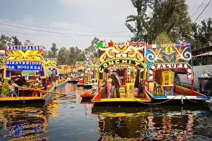 Embarcadero Prints: Mexican workers painting colorful trajineras boats in xochimilco