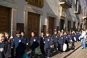 Holding Hands Prints: MEXICO Guanajuato Large group of young students in school uniforms walking down sidewalk holding hands