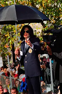 Courthouse Prints: Michael Jackson waves to fans on top of his SUV after his arraignment Friday January 16