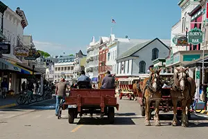 Great Lakes Prints: Michigan, Mackinac Island. Typical horse carriage in downtown Mackinac on Main Street (aka Huron)