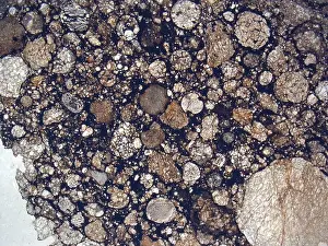 Micrograph of MAC 88199, 2 meteorite under plane-polarized light at 1.25x magnification. MAC 881992