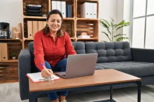 Counseling Prints: Middle age hispanic woman psychologist using laptop at psychology center