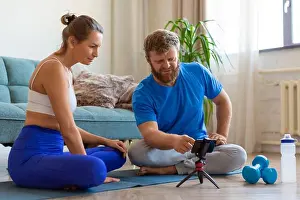 Meditate Prints: Middle aged couple opts for online yoga guide. Online yoga lesson. Mental health concept