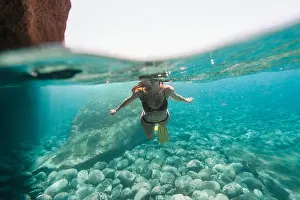Bikini Prints: Midsection of woman in bikini diving undersea