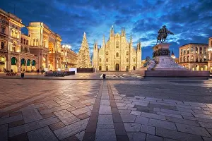 Milan, Italy at the Milan Duomo and Statua di Vittorio Emanuele II at twilight