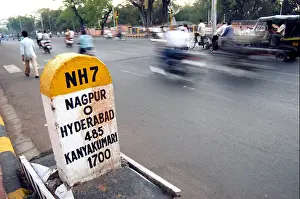 Expressway Prints: Milestone showing zero mile Nagpur 0 Hyderabad 485 Kanyakumari 1700 on NH7 which is the center of India at Nagpur