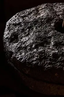 Canaries Prints: Detail of a millstone used for grinding corn at the Eco Museum showing artifacts and displays of the agricultural