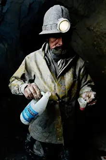 Miner Prints: Miner drinking alcohol inside Cerro Rico mountain, Potosi, Bolivia