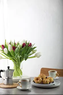 8 March Prints: Mini bundt cakes with fruits on plate, cup of coffe and bouquet of tulips