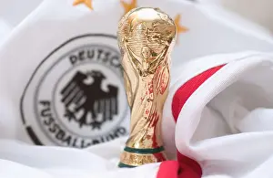 World Cup Prints: miniature copy of the soccer world cup trophy on the tricot of the german national team