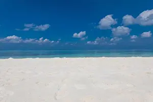 Minimal beach view, sea sand sky as relaxing summer scenery. Peaceful tropical beach landscape view. Clouds on blue sky, tranquil beach nature concept