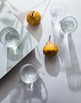 Thirst Prints: Minimalistic still life of pears and glasses of water top view