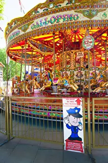 Fairground Prints: Minimum height sign on traditional carousel fair ground ride
