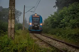 Silesia Prints: Mist morning with electric trains in Rajcza town with Sola river in middle of summer