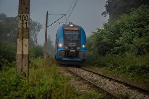 Silesia Prints: Mist morning with electric trains in Rajcza town with Sola river in middle of summer
