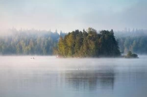 Images Dated 25th August 2019: Misty landscape with fisherman and beautiful morning light at mood summer morning in Finland