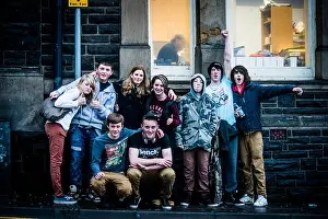 Mates Prints: A mixed group of 9 happy smiling teenage boys and girls together, on a street, UK