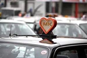 Kyoto Prints: MK Loveheart sign on top of taxi in city of Kyoto Japan Asia Amusing funny comic humourous