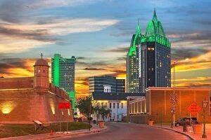 Cityscape Collection: Mobile, Alabama, USA downtown skyline with Fort Conde's corner turret at dusk
