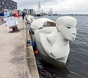 Mobile sculptures made of concrete called Life-Boats by Norwegian Marit Benthe Norheim moored in the Harbour Aalborg