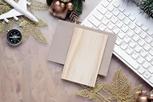 Merry Christmas Prints: Mockup blank wood board for Christmas New Year holiday travel background concept on home office desk