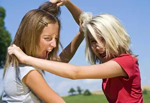 Sisters Prints: Model release, Zwei Freundinen raufen miteinander - two girl friends fight with each other