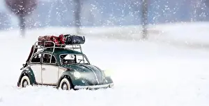 Hoarfrost Prints: Model of Volksvagen Beetle tin photographed in a winter context