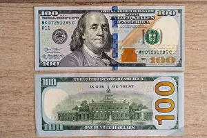 Transaction Prints: Modern 100 US dollar bill front and back sides on wooden surface