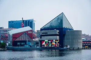 Water Reflection Prints: Modern architecture and a historic ship are reflected in the water of Baltimore harbor