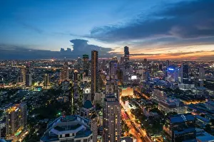 Blue Day Prints: Modern building in Bangkok business district at Bangkok city with skyline at twilight