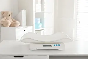 Childcare Prints: Modern digital baby scales on table in clinic