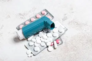 Pills Prints: Modern inhaler and pills on light background