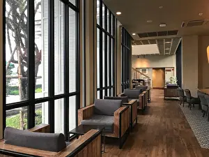 Upholstery Prints: Modern interior room design with small sofa set, in the cafe background