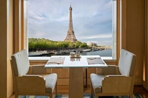 Images Dated 16th April 2017: Modern luxury restaurant interior with romantic sence Eiffel Tower and Seine river view in Paris