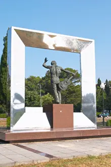 Gora Prints: A modern statue of a musician with a guitar
