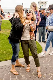 Adult Woman Prints: A mom and daughter dance to the music of Cole Porter at an outdoor music festival in Laguna Beach