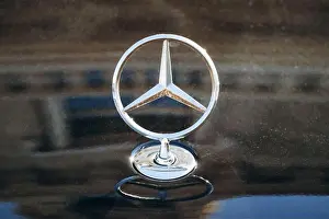 Sophistication Prints: Monaco, Monaco - 20 January 2024: Close-up of a Mercedes badge on a car in Monaco