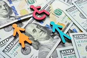 Discrimination Prints: Money and figures on them as a symbol of income inequality and wage gap