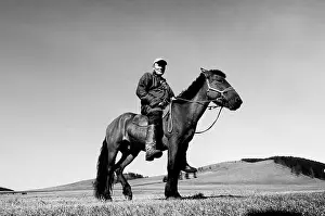Mongolia Prints: A Mongolian nomads on his horse