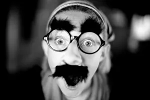 Comical Prints: monochromatic portrait of girl wearing silly mask