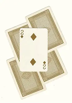 Chance Prints: A montage of vintage playing card backs in sepia with a two revealed on a cream background