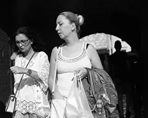 Adriatic Sea Prints: Montenegro, Sep 22, 2019: Two women passing an archway entrance to the Old Town of Kotor (B/W)