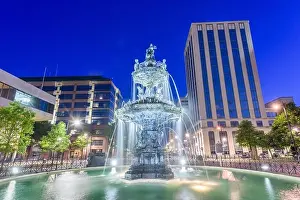 Montgomery, Alabama, USA fountain and downtown cityscape at twilight