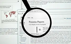 Release Prints: MONTREAL, CANADA - APRIL 7, 2016 : The Panama Papers article on Wikipedia under magnifying glass