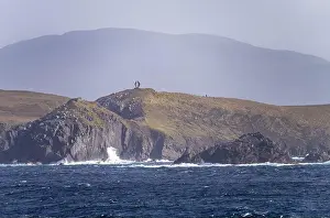 Cruising Prints: Monument on cliffs by Cape Horn depicts albatross in flight